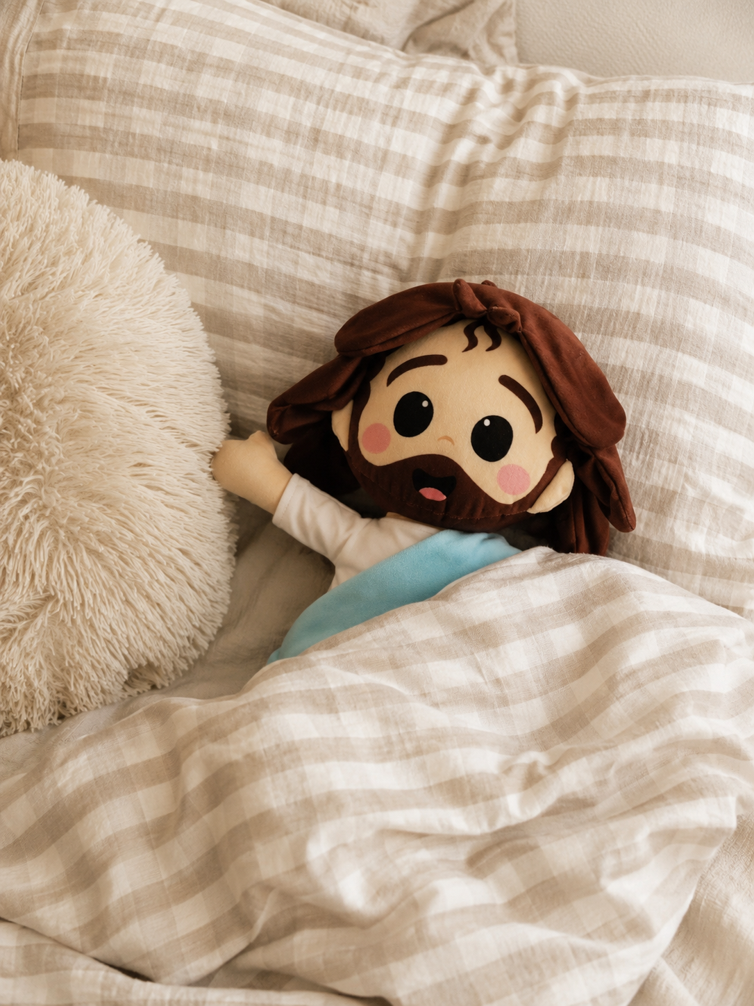 a) Peluche de Jesús