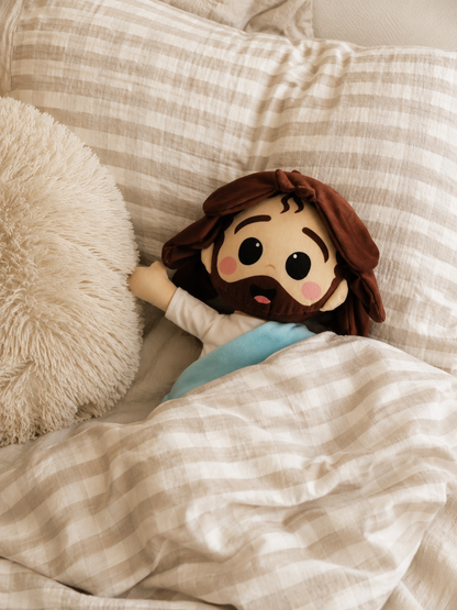 a) Peluche de Jesús