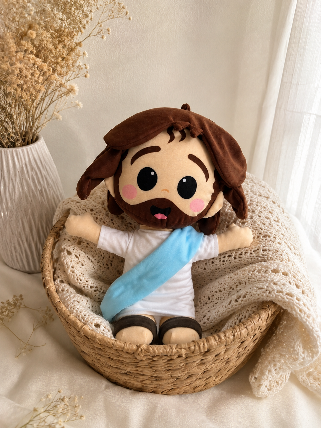 a) Peluche de Jesús